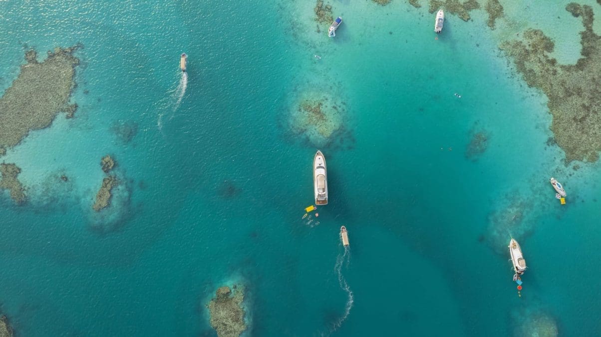 Aerial shot of Saudi sea with super yachts anchored in the waters