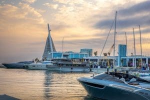 Saudi port during the day with super yachts, restaurants and shops